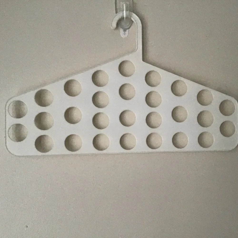 Closet hanger accessories holder